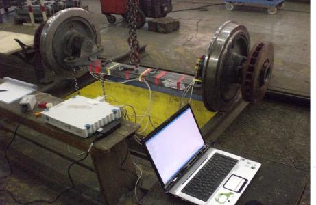 Static calibration of an instrumented tram wheelset using one of our 5 HBK Spider 8, still going strong. (2007)